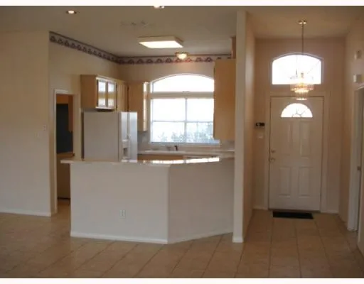 a view of kitchen cabinet and window