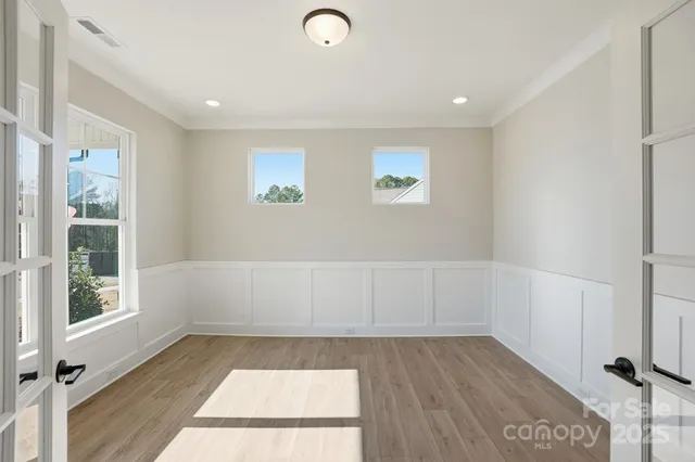 a view of room with window and hardwood floor