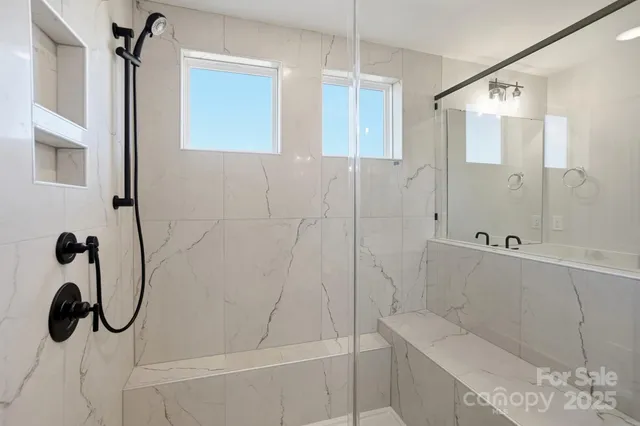 a bathroom with a shower and a bathtub