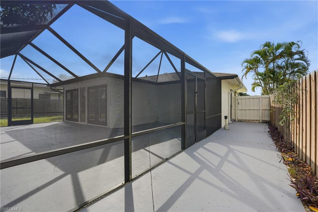 1205 Hilltop Drive Naples, FL 34103 - Photo 9 of 15 a view of a house with a backyard