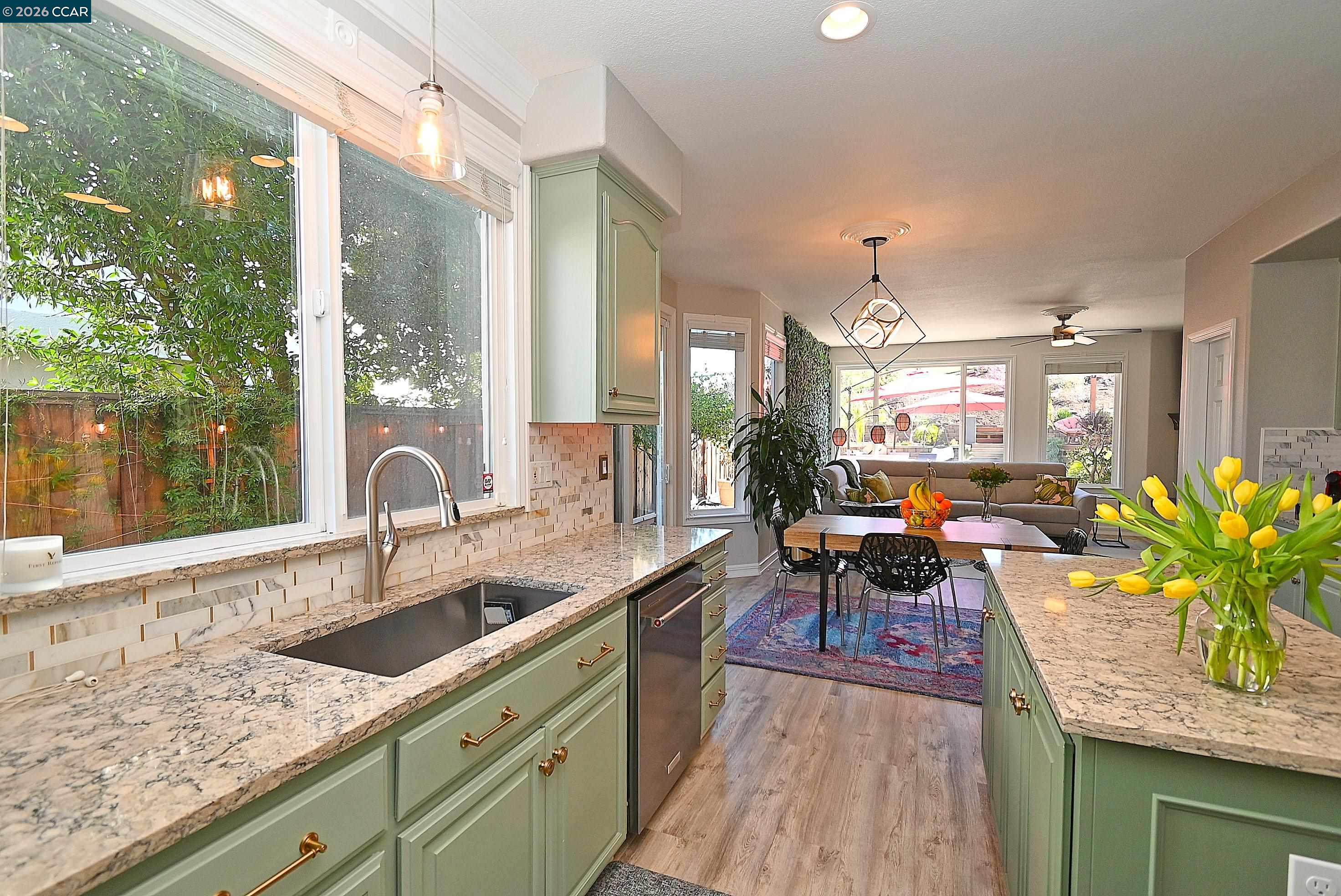 829 Deer Spring Circle Concord, CA 94521 - Photo 12 of 50 a kitchen with sink stove and table