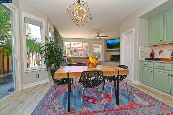 a view of a dining room with furniture window and wooden floor