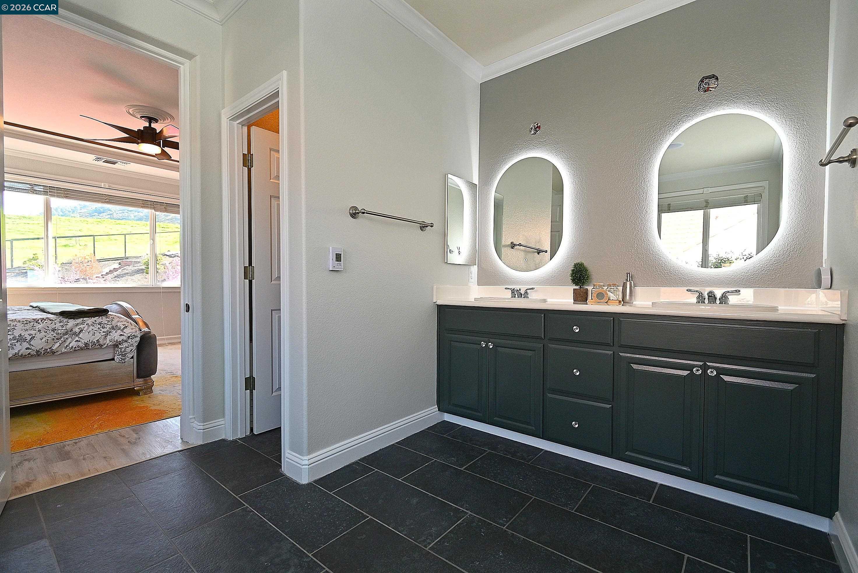 829 Deer Spring Circle Concord, CA 94521 - Photo 22 of 50 a spacious bathroom with a double vanity sink and a mirror