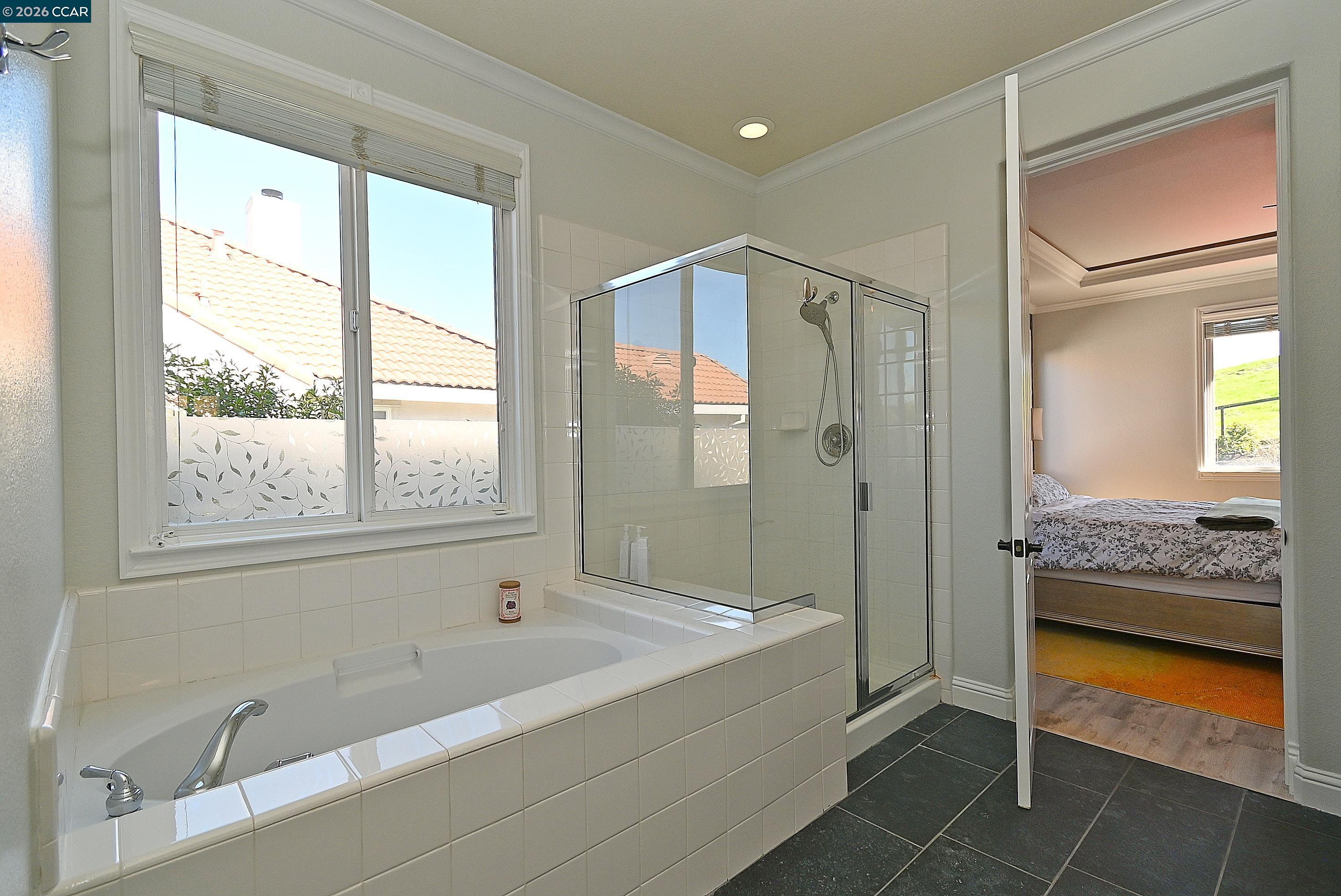 829 Deer Spring Circle Concord, CA 94521 - Photo 23 of 50 a bathroom with a tub shower and sink
