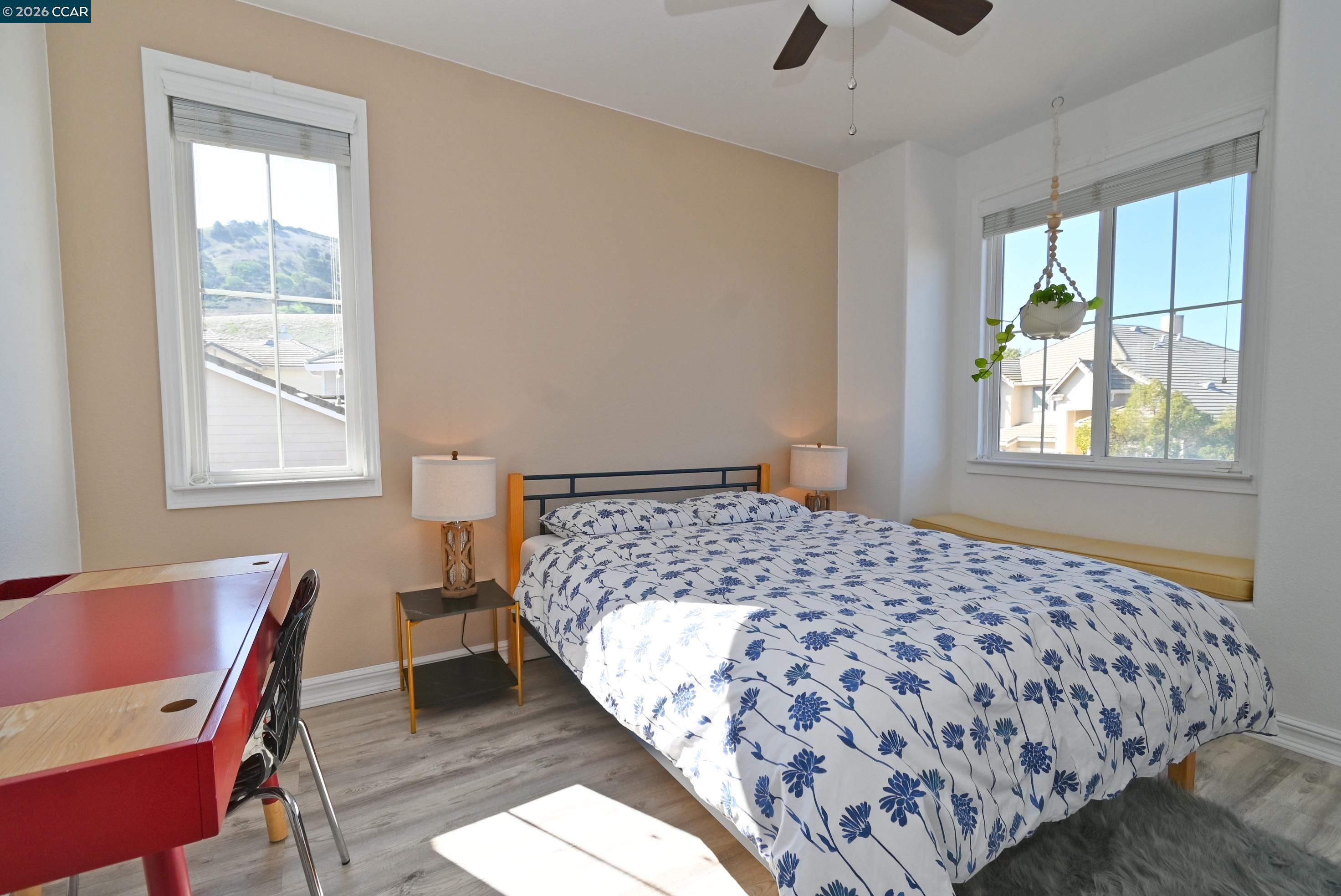 829 Deer Spring Circle Concord, CA 94521 - Photo 27 of 50 a bedroom with a bed and a chair