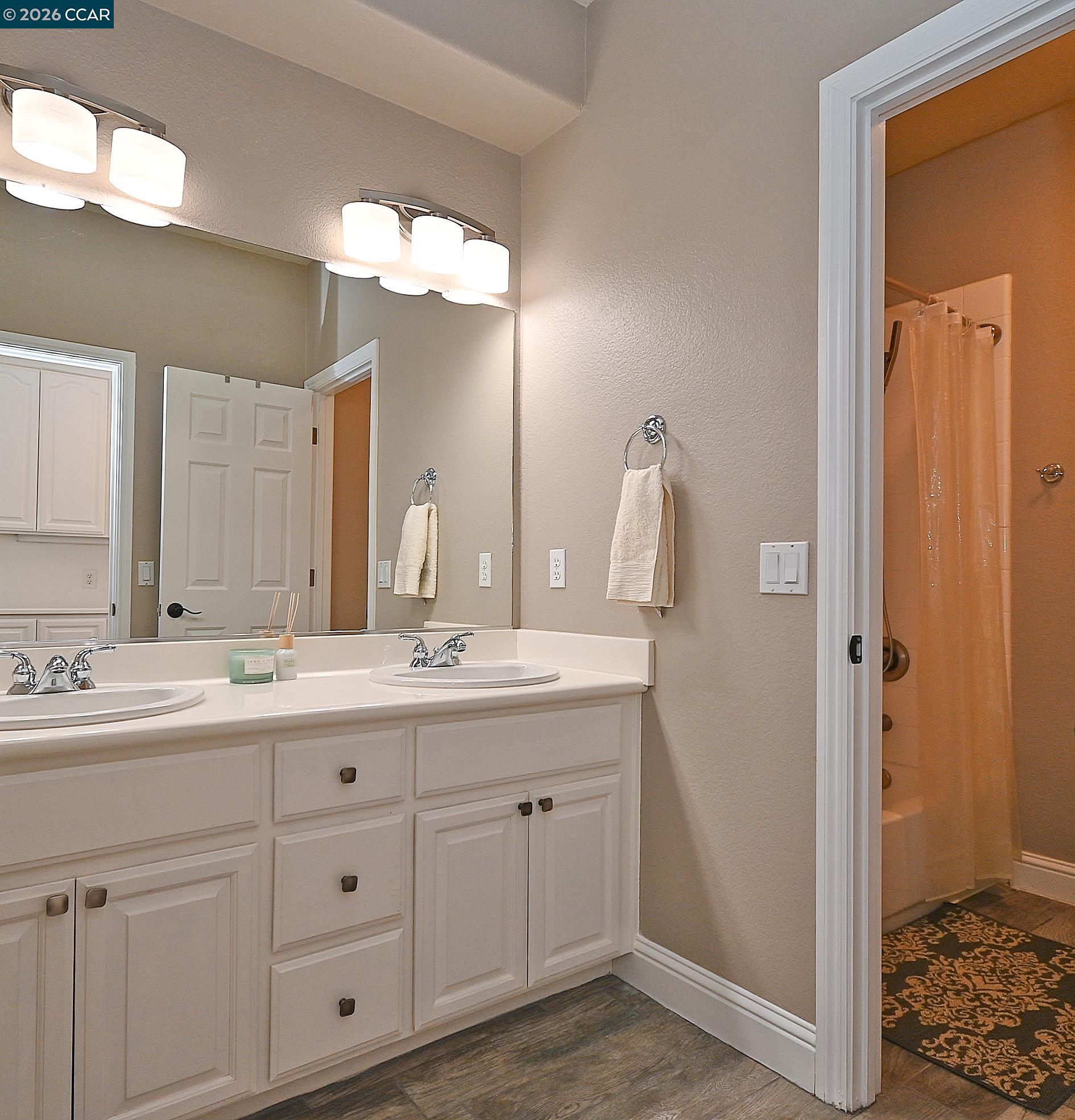 829 Deer Spring Circle Concord, CA 94521 - Photo 28 of 50 a bathroom with a sink and a mirror