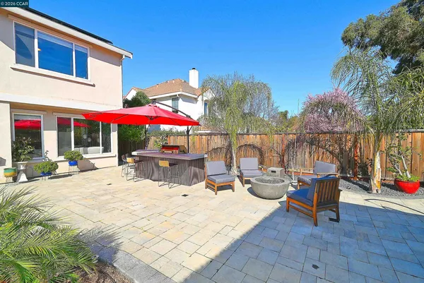 a view of a patio with chairs and tables