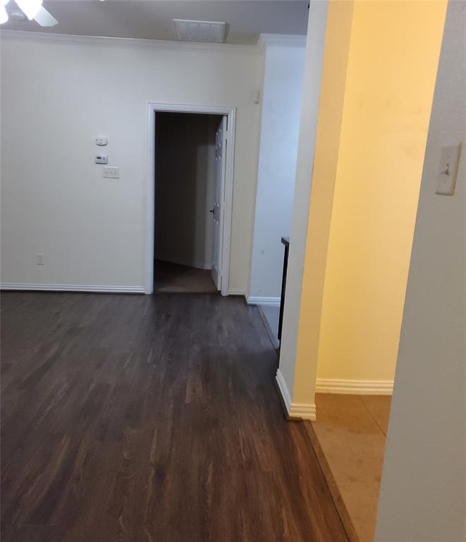 3015 Tudor Lane Irving, TX 75060 - Photo 15 of 15 a view of a hallway with wooden floor