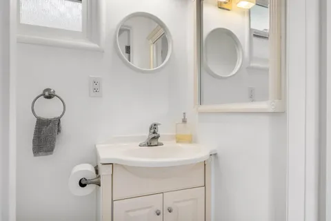 a bathroom with a sink and a mirror