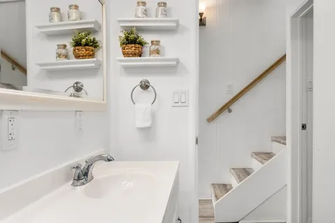 a bathroom with a sink and a window