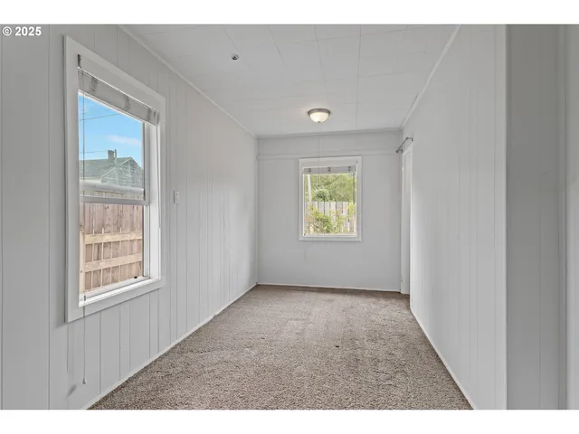 view of hall way with furniture