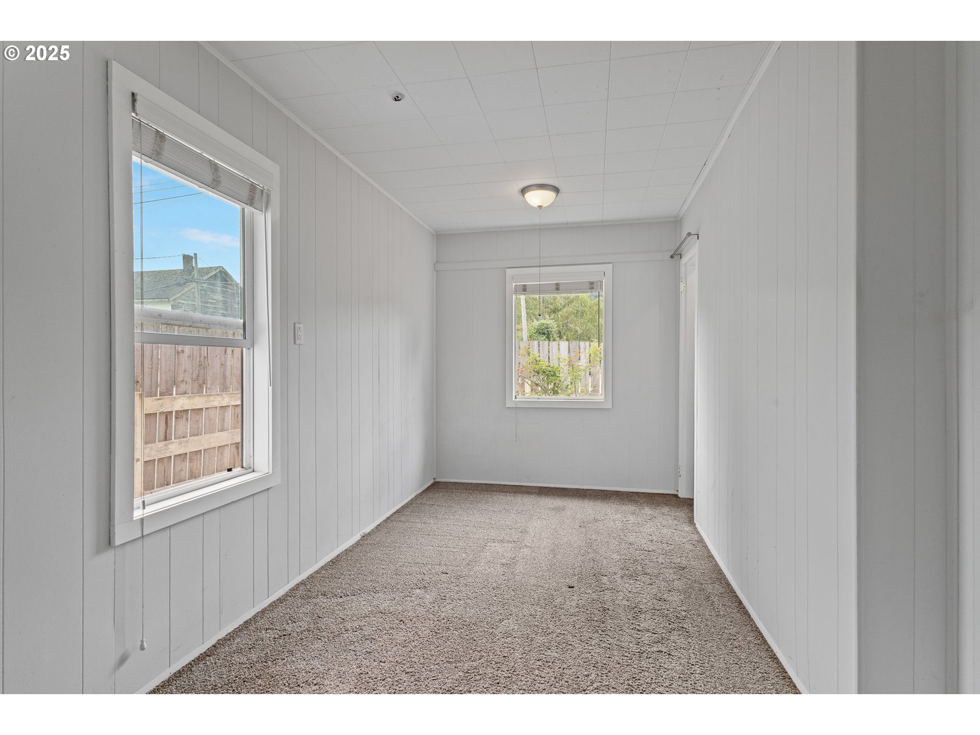 141 Poplar Street Powers, OR 97466 - Photo 11 of 37 a view of an empty room with a window