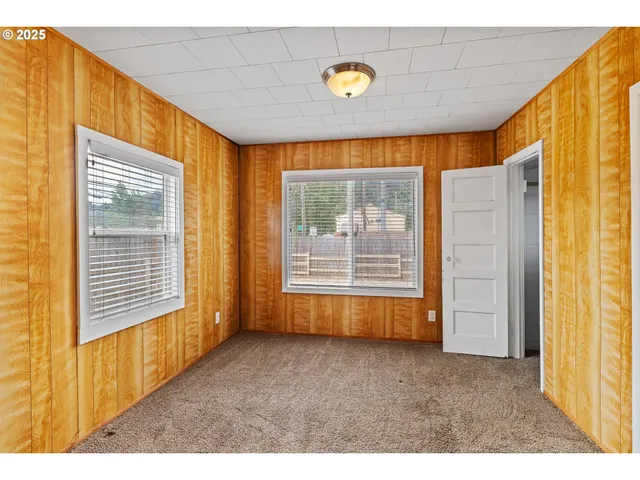 a view of an empty room and a window