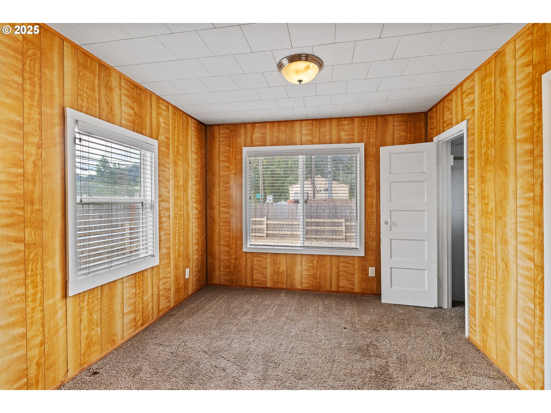 141 Poplar Street Powers, OR 97466 - Photo 16 of 37 a view of an empty room and a window