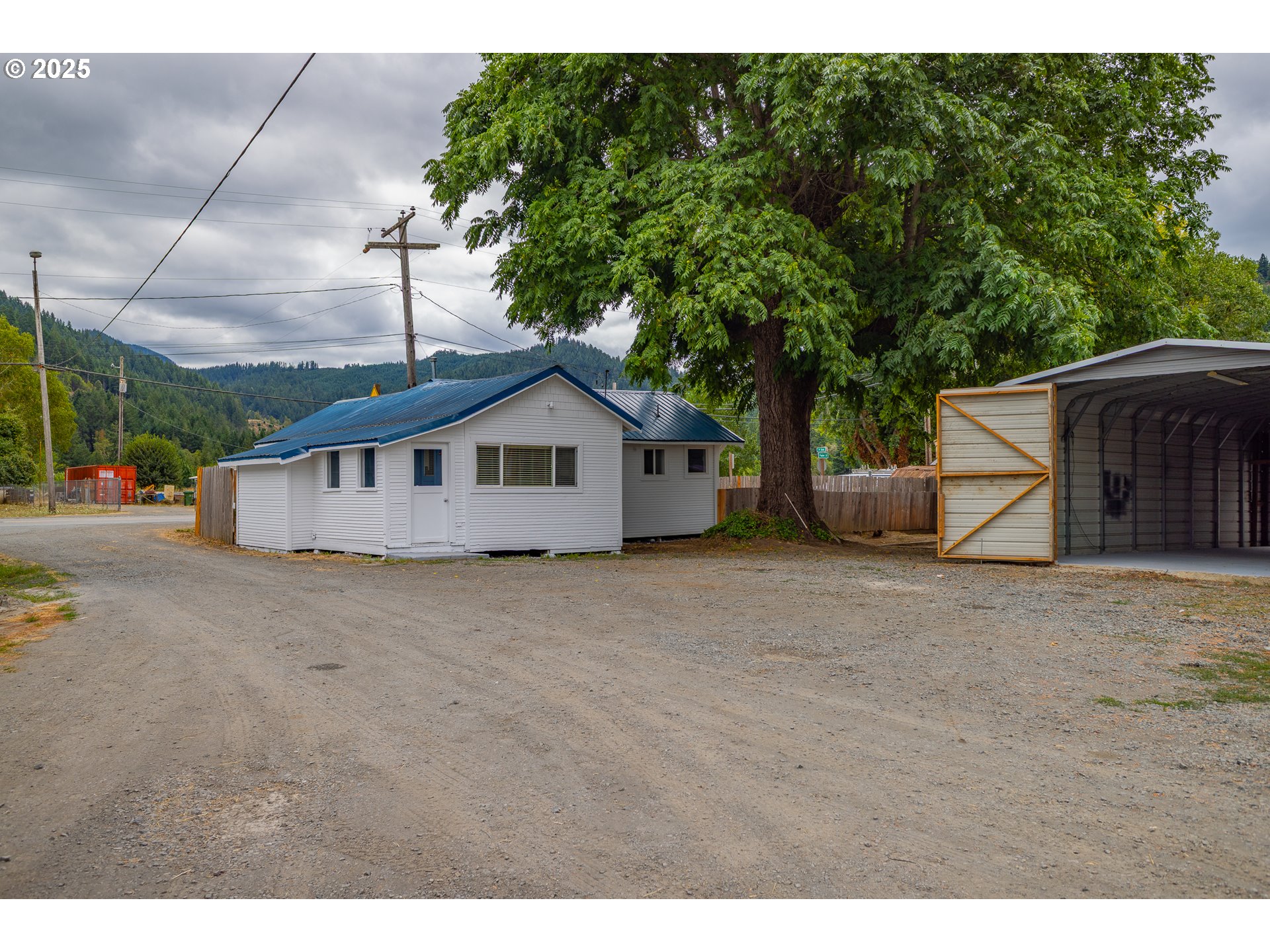 141 Poplar Street Powers, OR 97466 - Photo 23 of 37 a front view of a house with a yard