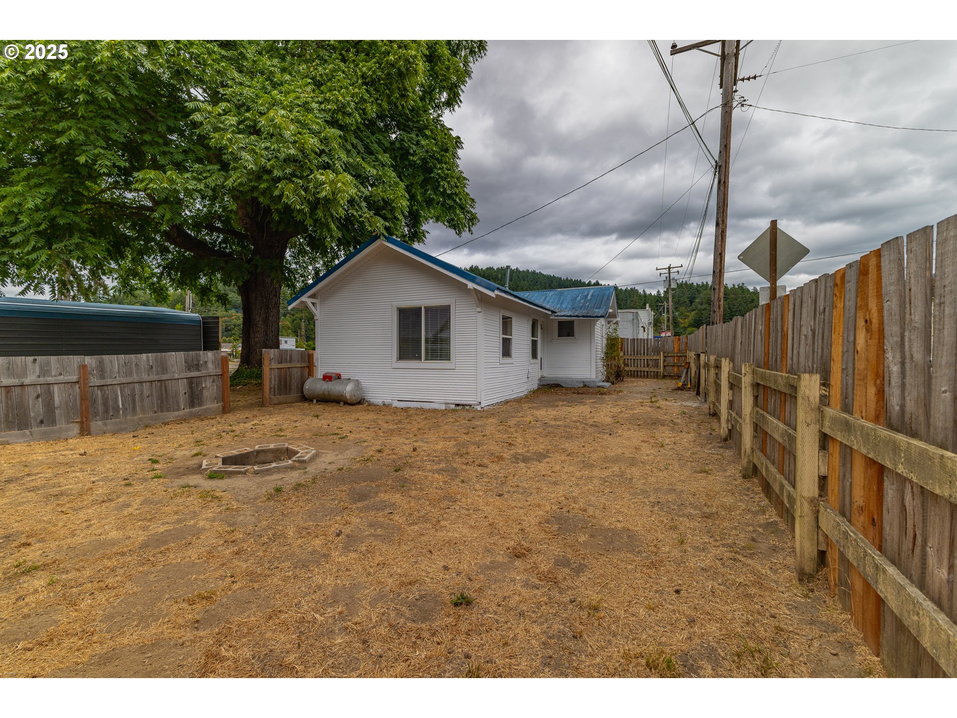 141 Poplar Street Powers, OR 97466 - Photo 29 of 37 a bathroom with a sink and a yard