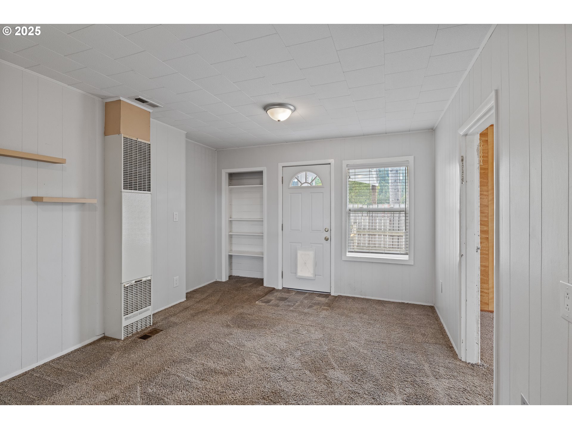 141 Poplar Street Powers, OR 97466 - Photo 4 of 37 a view of an empty room with window