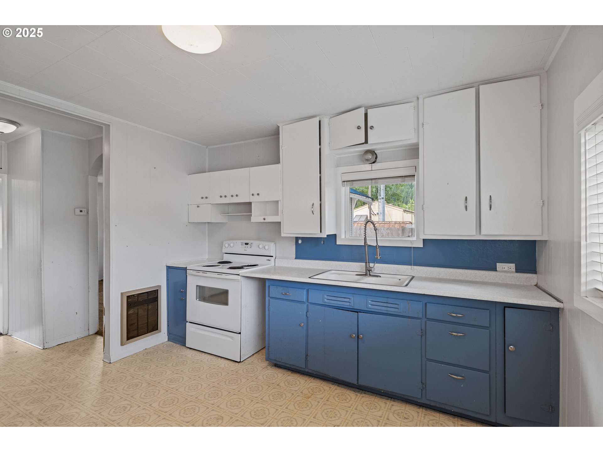 141 Poplar Street Powers, OR 97466 - Photo 7 of 37 a kitchen with a sink stove and cabinets