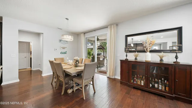 a large kitchen with stainless steel appliances cabinets and a counter top space
