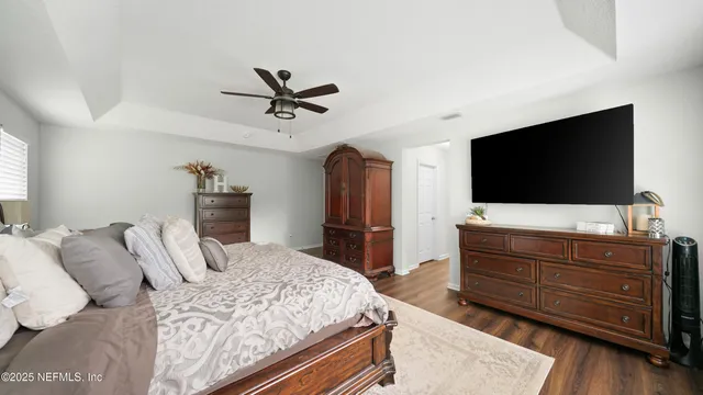 a bathroom with a sink a toilet a mirror and a window