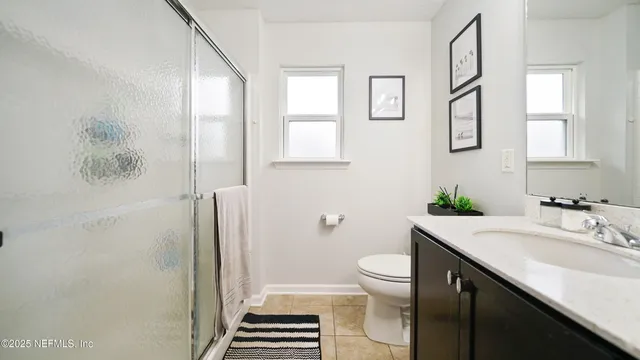 a view of a patio with couches and floor to ceiling window