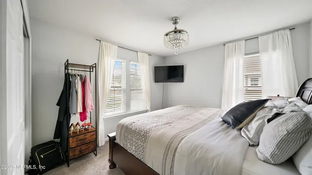 a view of a house with swimming pool and sitting area