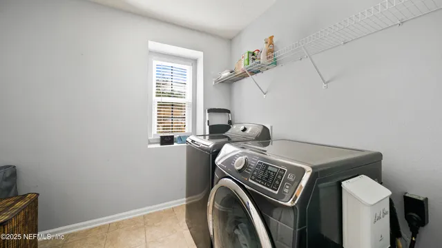 a view of a house with pool fire pit next to a yard