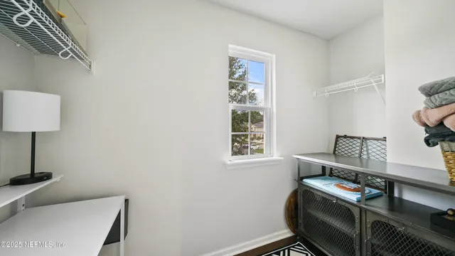 a view of a swimming pool with chairs