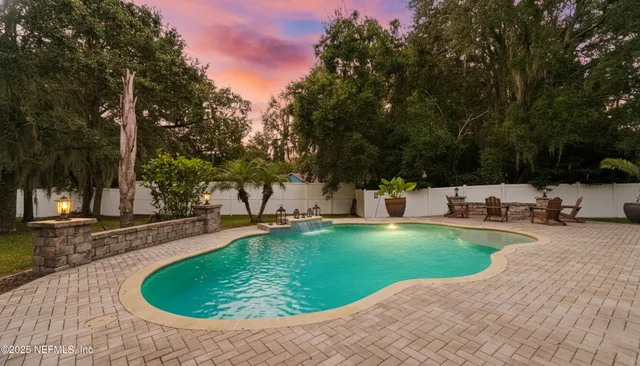 a backyard of a house with yard and outdoor seating
