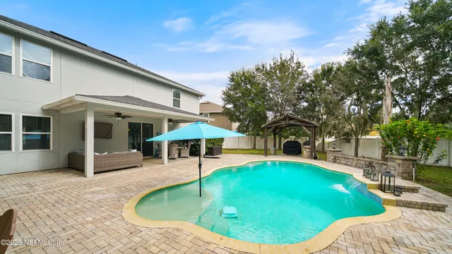 an aerial view of a house with garden view