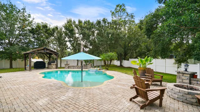 an aerial view of a houses with outdoor space and street view