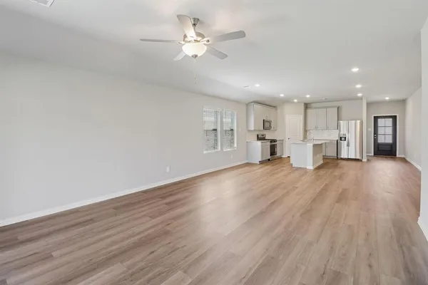 a view of a kitchen with a dishwasher kitchen stove and cabinets