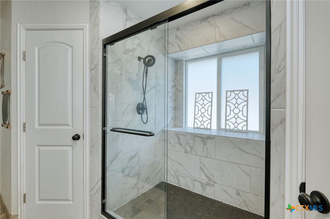 3403 Northwest Boulevard Georgetown, TX 78628 - Photo 14 of 28 a bathroom with a shower