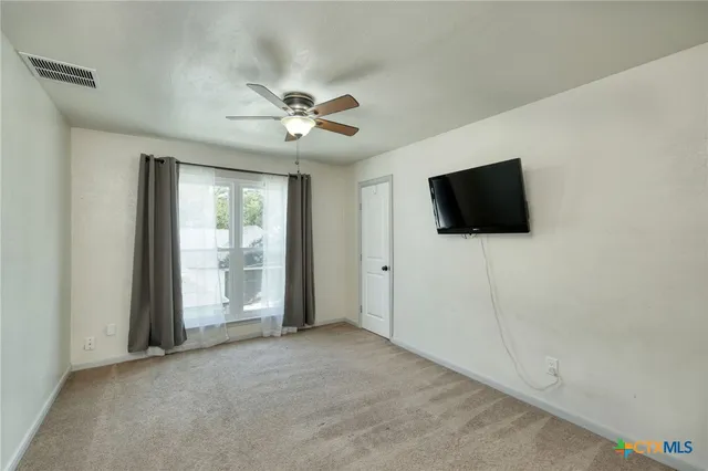 a view of a livingroom with a flat screen tv
