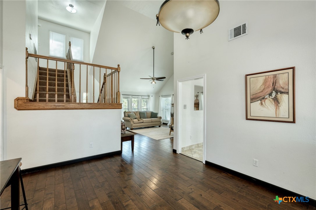3403 Northwest Boulevard Georgetown, TX 78628 - Photo 7 of 28 a view of a hallway with wooden floor and workspace