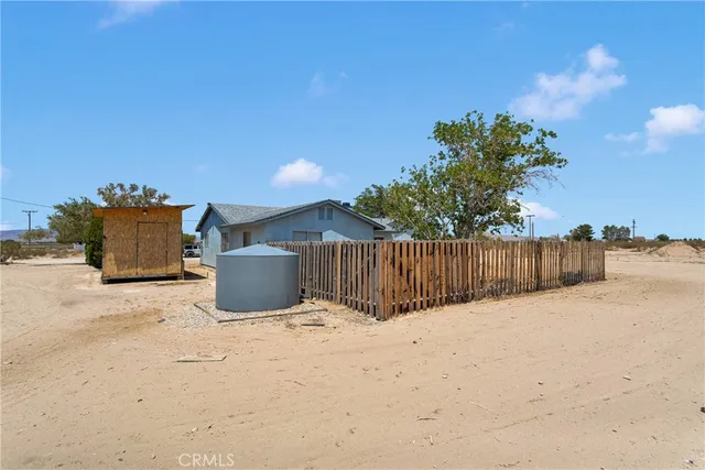 a view of a outdoor space with wooden fence