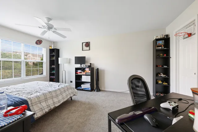 a bedroom with furniture and a window