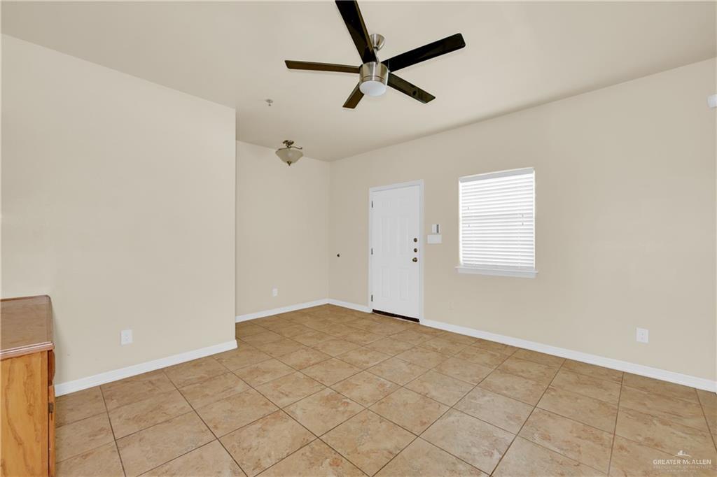 1814 East Iowa Road Edinburg, TX 78542 - Photo 12 of 22 a view of a room with a window and a ceiling fan