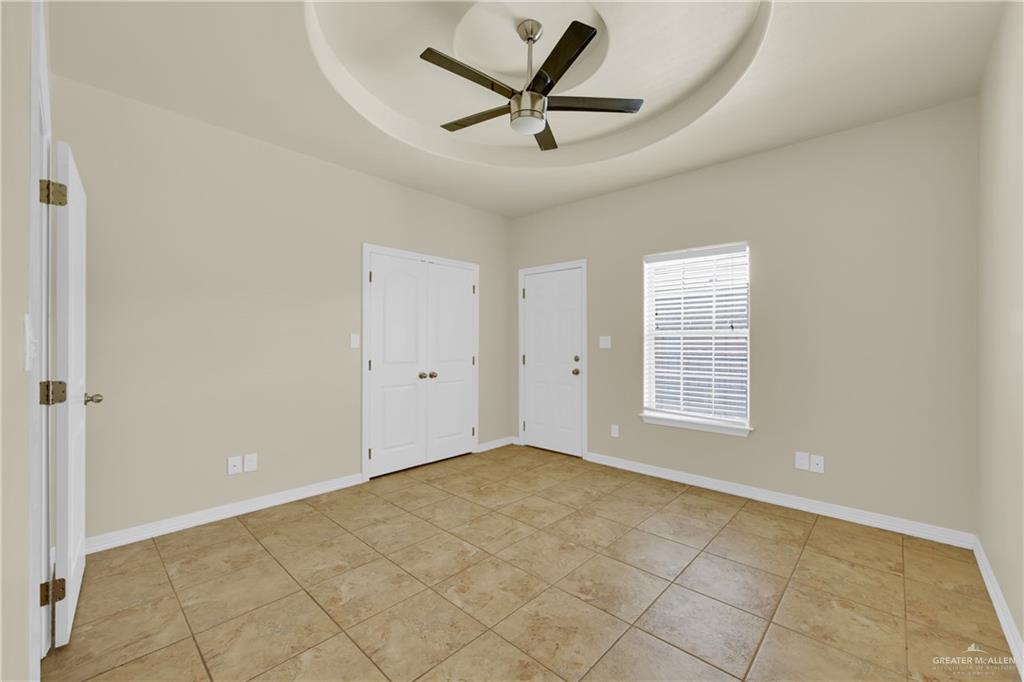 1814 East Iowa Road Edinburg, TX 78542 - Photo 7 of 22 a view of a livingroom with a ceiling fan and window