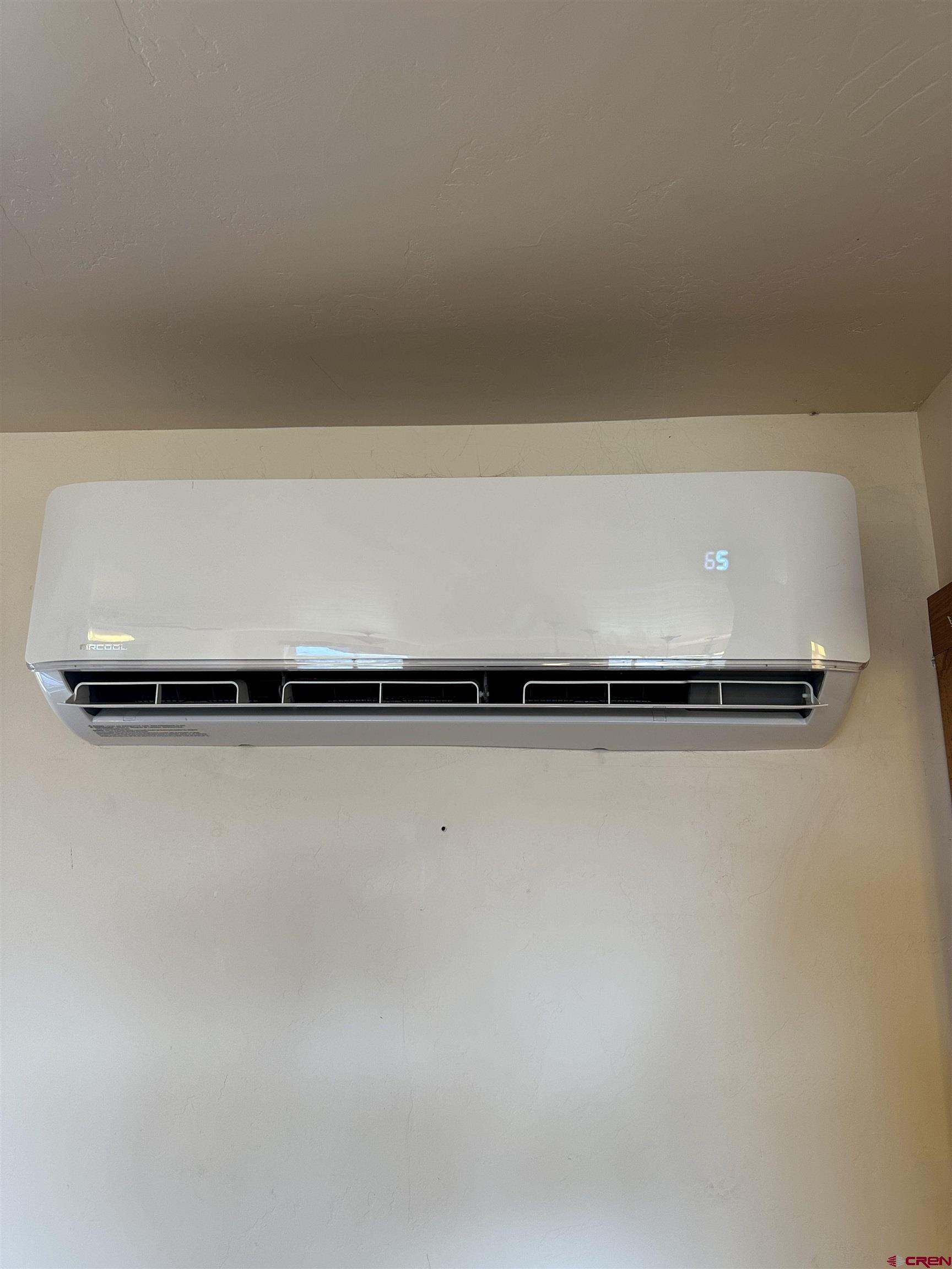 18180 Hanson Road Cedaredge, CO 81413 - Photo 28 of 34 a view of a refrigerator with white comforter