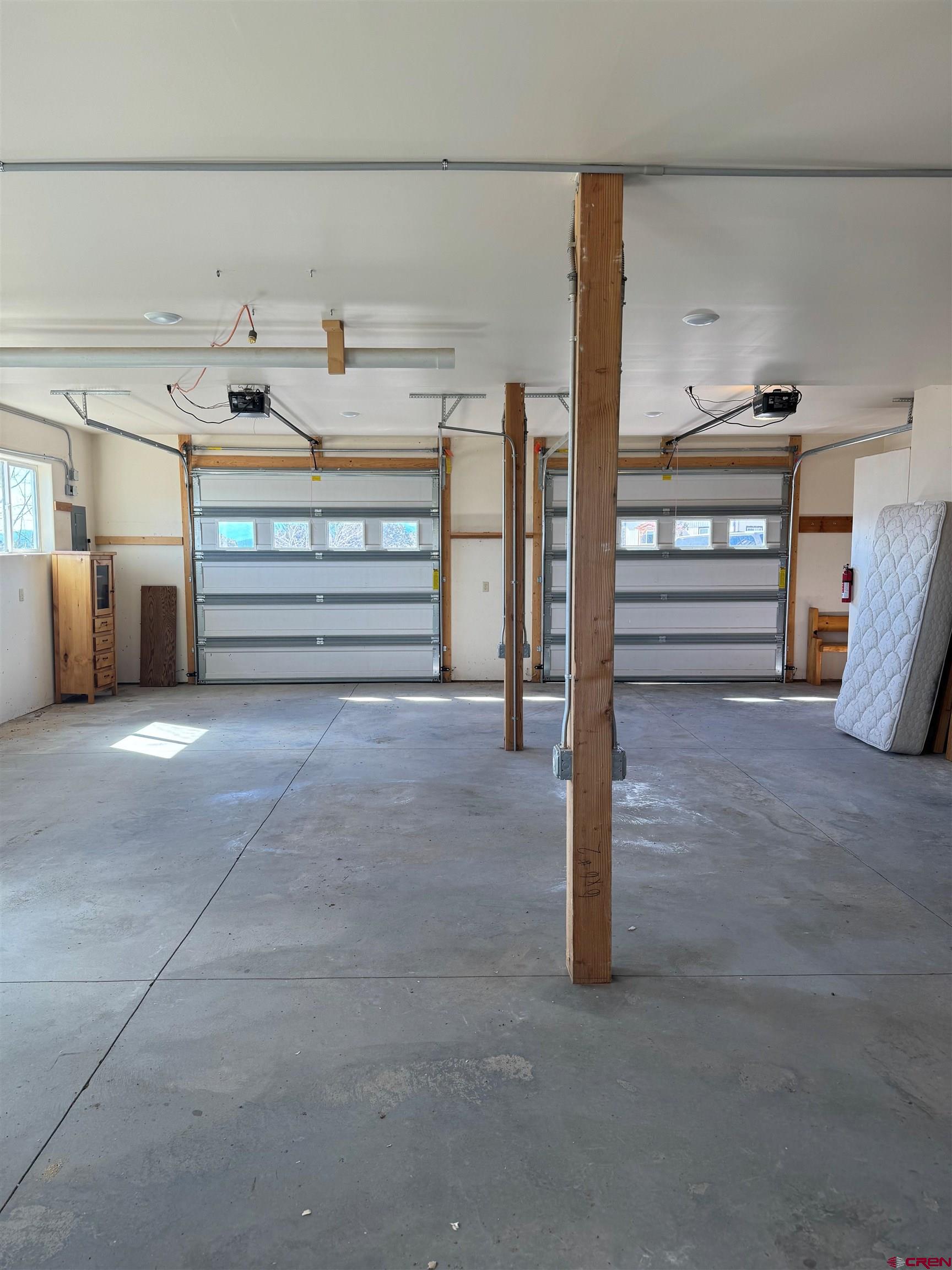18180 Hanson Road Cedaredge, CO 81413 - Photo 34 of 34 a view of storage and utility room with two washing machine