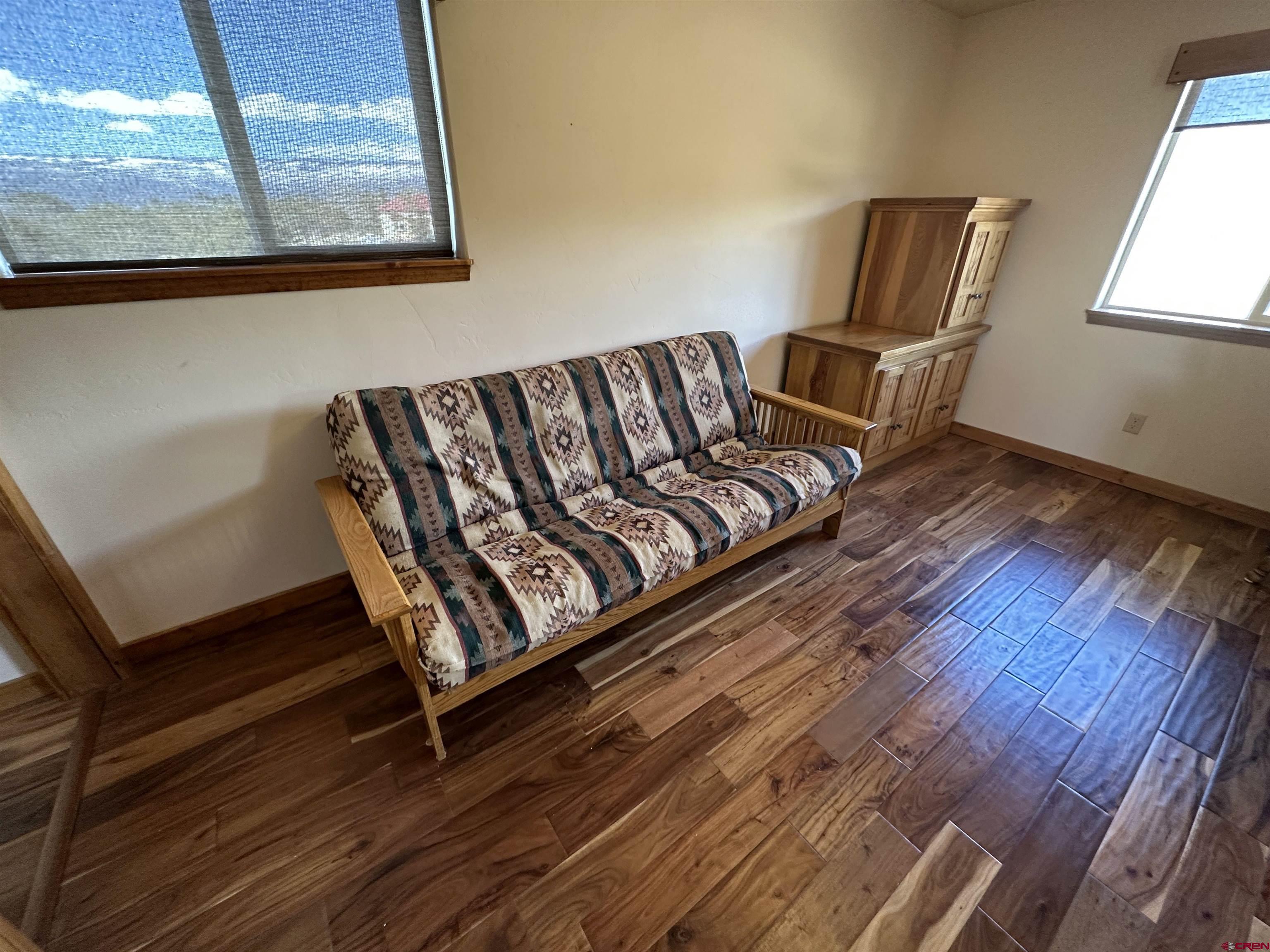 18180 Hanson Road Cedaredge, CO 81413 - Photo 10 of 34 a view of sitting area with furniture and window