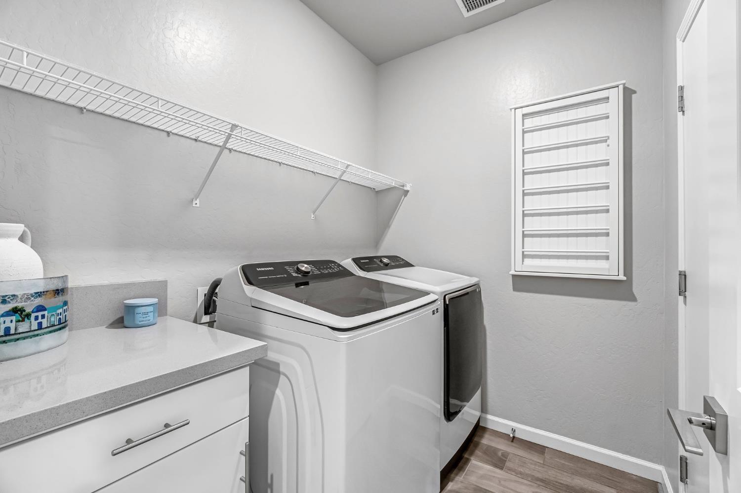 968 Pinnacle Drive Madera, CA 93636 - Photo 23 of 39 a view of storage and utility room with washer and dryer