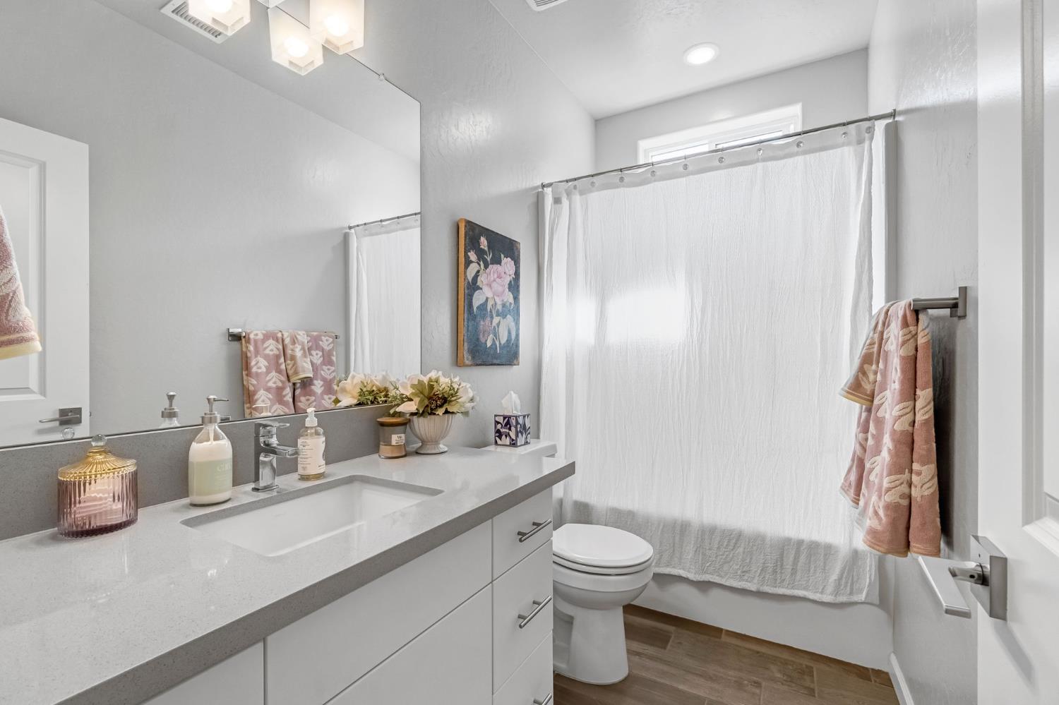 968 Pinnacle Drive Madera, CA 93636 - Photo 26 of 39 a bathroom with a granite countertop sink toilet and shower