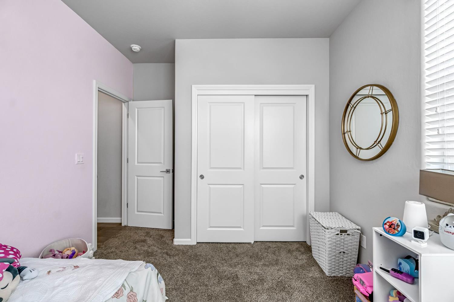 968 Pinnacle Drive Madera, CA 93636 - Photo 28 of 39 a bedroom with a bed a clock and a window