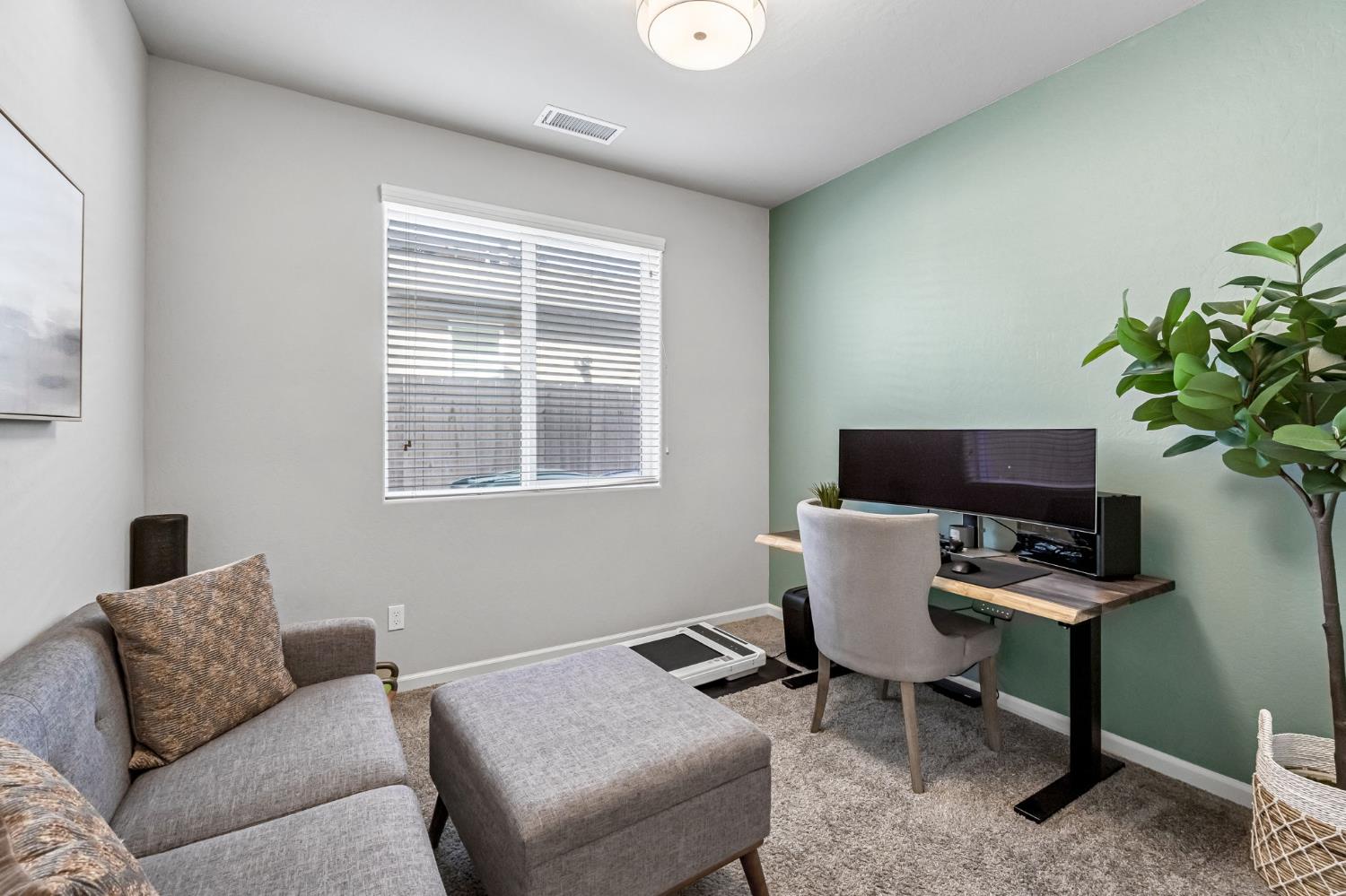 968 Pinnacle Drive Madera, CA 93636 - Photo 29 of 39 a workspace with furniture and a potted plant