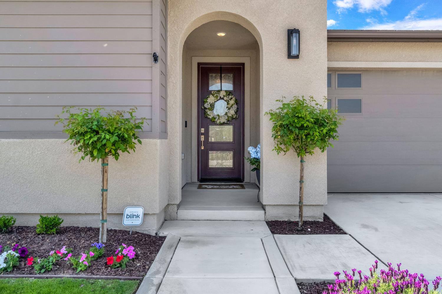 968 Pinnacle Drive Madera, CA 93636 - Photo 4 of 39 a vase with flowers sitting on a floor in front of a door