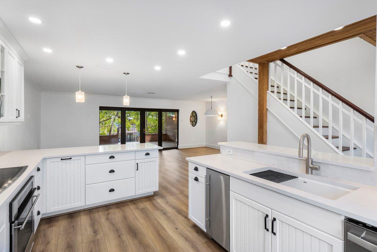 720 Mariners Way Boynton Beach, FL 33435 - Photo 2 of 49 a kitchen with white cabinets a sink and dishwasher