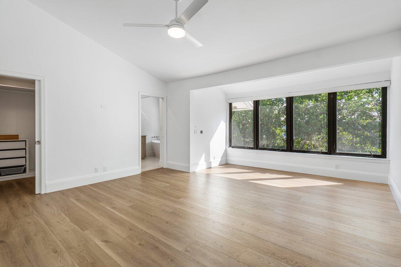 720 Mariners Way Boynton Beach, FL 33435 - Photo 24 of 49 a view of an empty room with wooden floor and a window