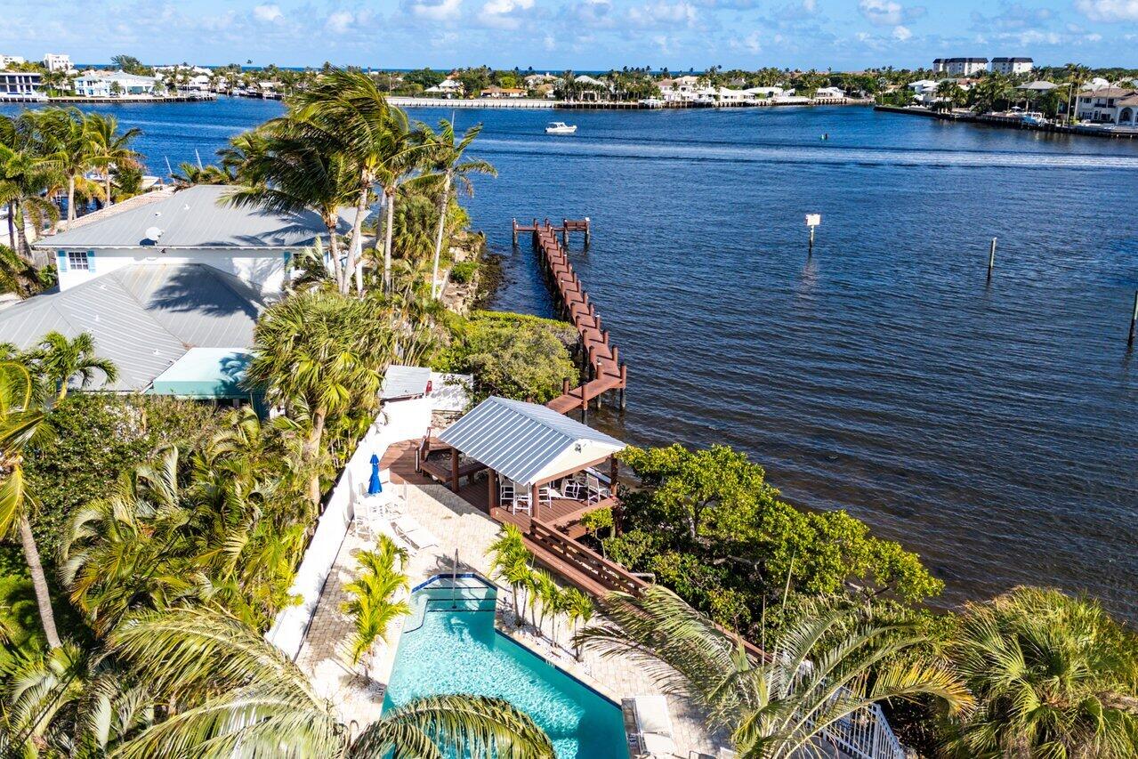 720 Mariners Way Boynton Beach, FL 33435 - Photo 47 of 49 a view of a lake with a building in the background